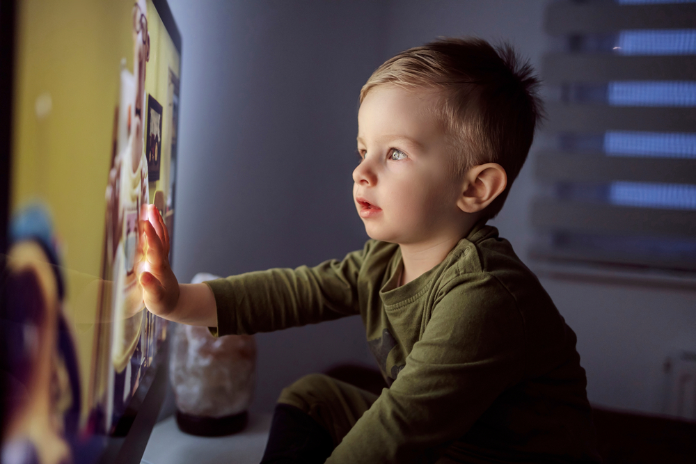 Child watching TV ads