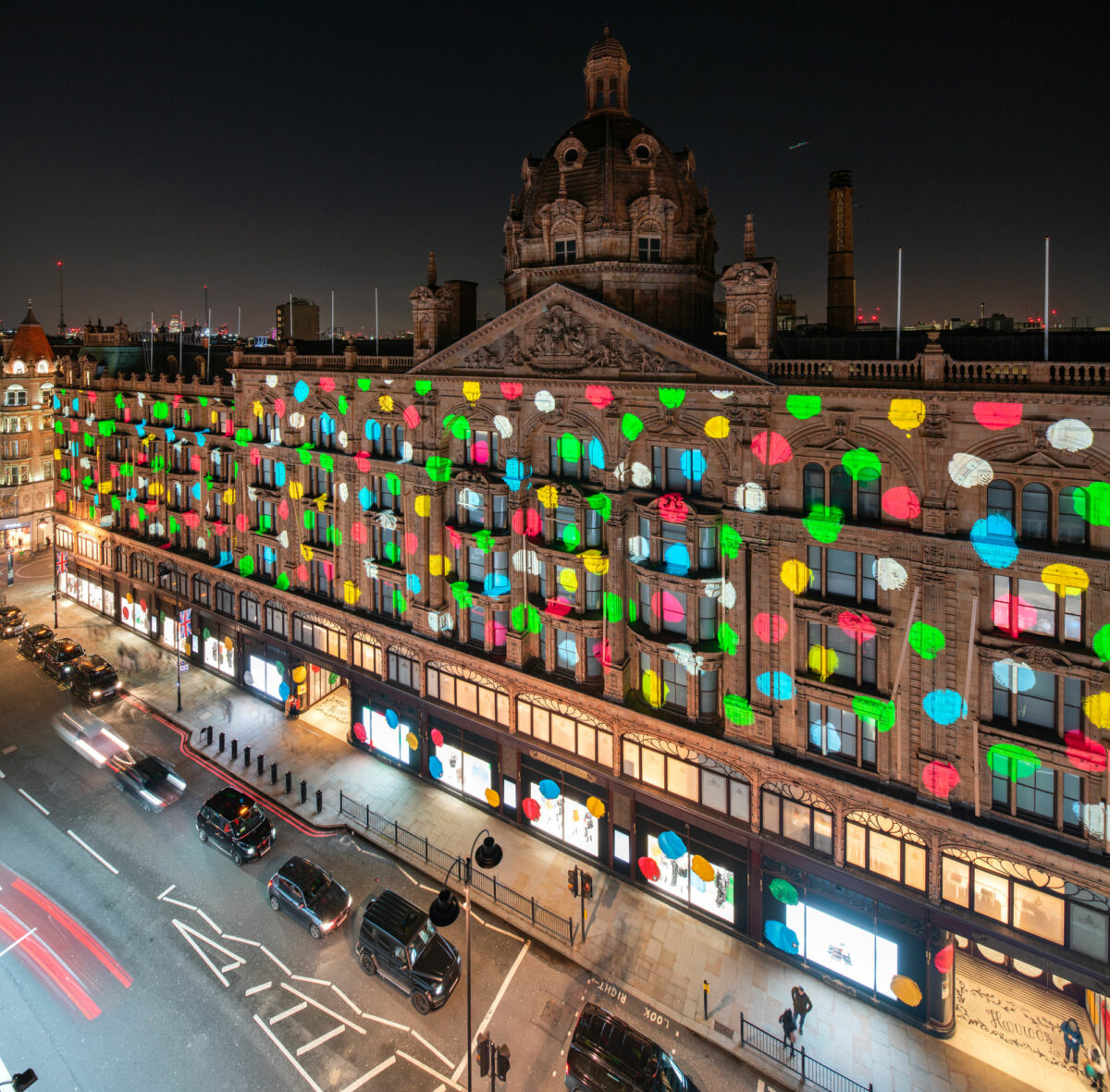 Louis Vuitton has celebrated a collaboration with Yayoi Kusama by projecting the artist's designs onto the façade of Harrods - a media first.