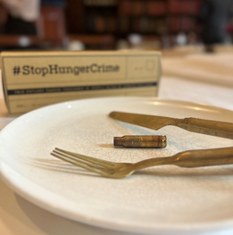 Action Against Hunger - an image from the charity's breakfast that highlighted the issues between hunger and conflcit by serving guests empty plates
