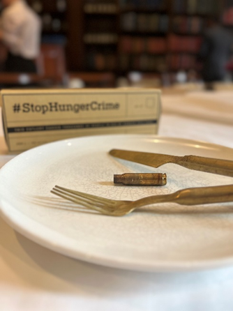 Action Against Hunger - an image from the charity's breakfast that highlighted the issues between hunger and conflcit by serving guests empty plates