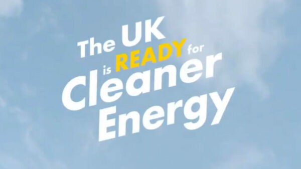 Shell's campaign where text reads "The UK is READY for Cleaner Energy" in white text. Word "READY" in yellow. Background is blue sky.