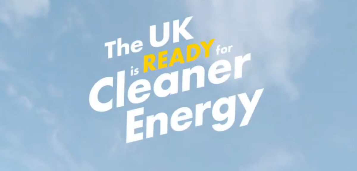 Shell's campaign where text reads "The UK is READY for Cleaner Energy" in white text. Word "READY" in yellow. Background is blue sky.