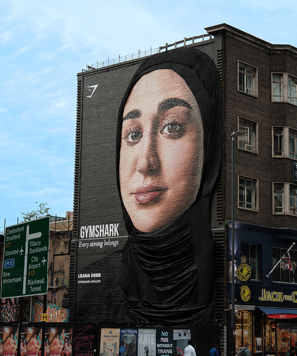 Sportswear brand Gymshark has unveiled the 'world's first modest billboard' new 3D out-of-home mural featuring brand ambassador, Leana Deeb, depicted here.