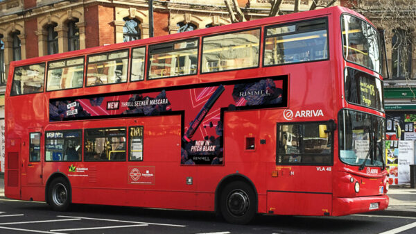 Rimmel is celebrating the unveiling of its new Thrill Seeker Pitch Black mascara with a two-fold campaign aimed at targeting its Gen Z consumers, depicted here on a red double decker bus with the beauty brand's promotional advertising alongside it.