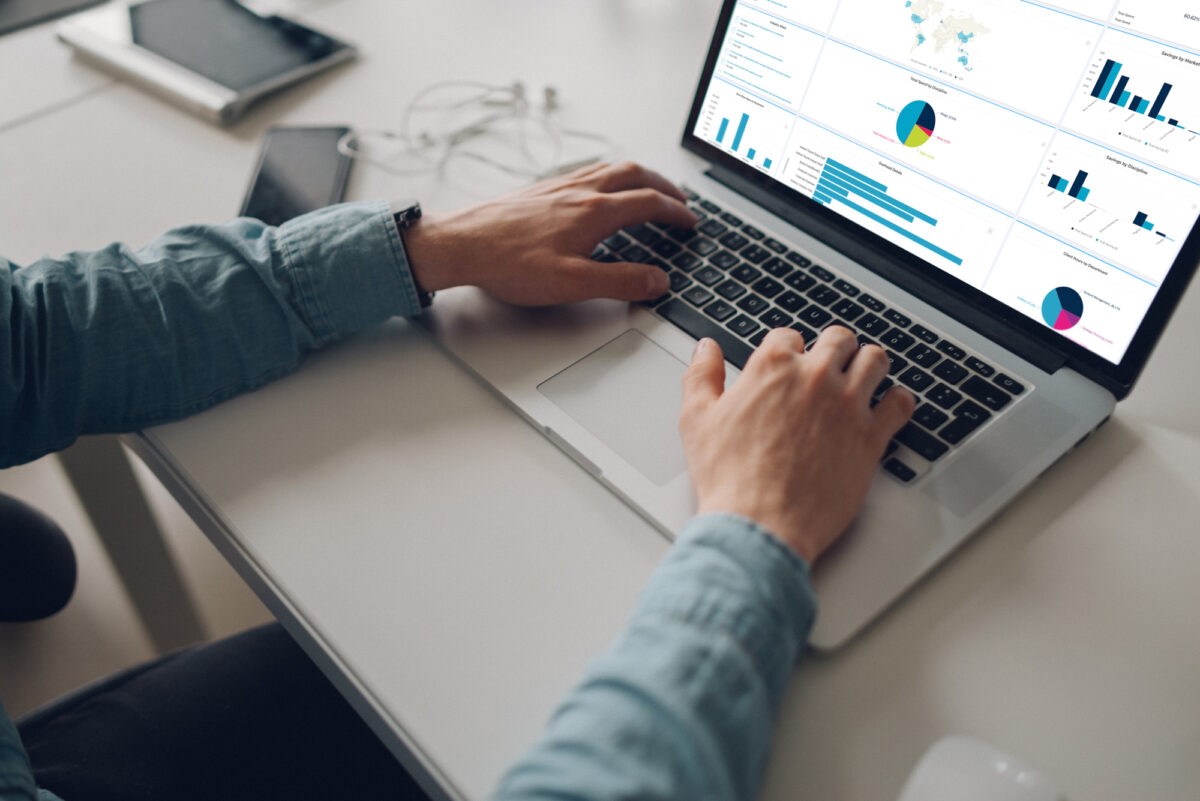 More than nine in ten CMOs say that staying informed about agency investments and fostering open communication boosts financial returns, here depicting a person on a computer