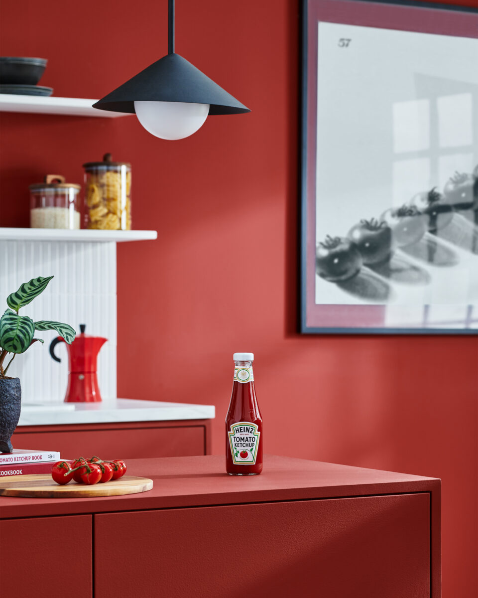 Heinz has teamed up with paint brand Lick to unveil a limited-edition paint colour inspired by the condiments brand's iconic Tomato Ketchup, depicted here in a home setting with various items painted with the ketchup-themed hue.