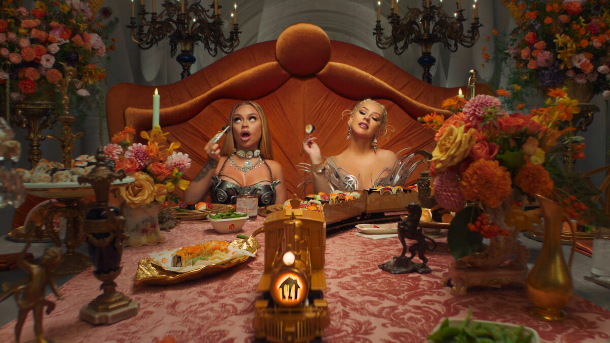 Image from Just Eat ad featuring Christina Aguilera.Just Eat Takeaway.com has cut its marketing spend back from £630,000 ( €735m) to £503m (€588m) in the past year.