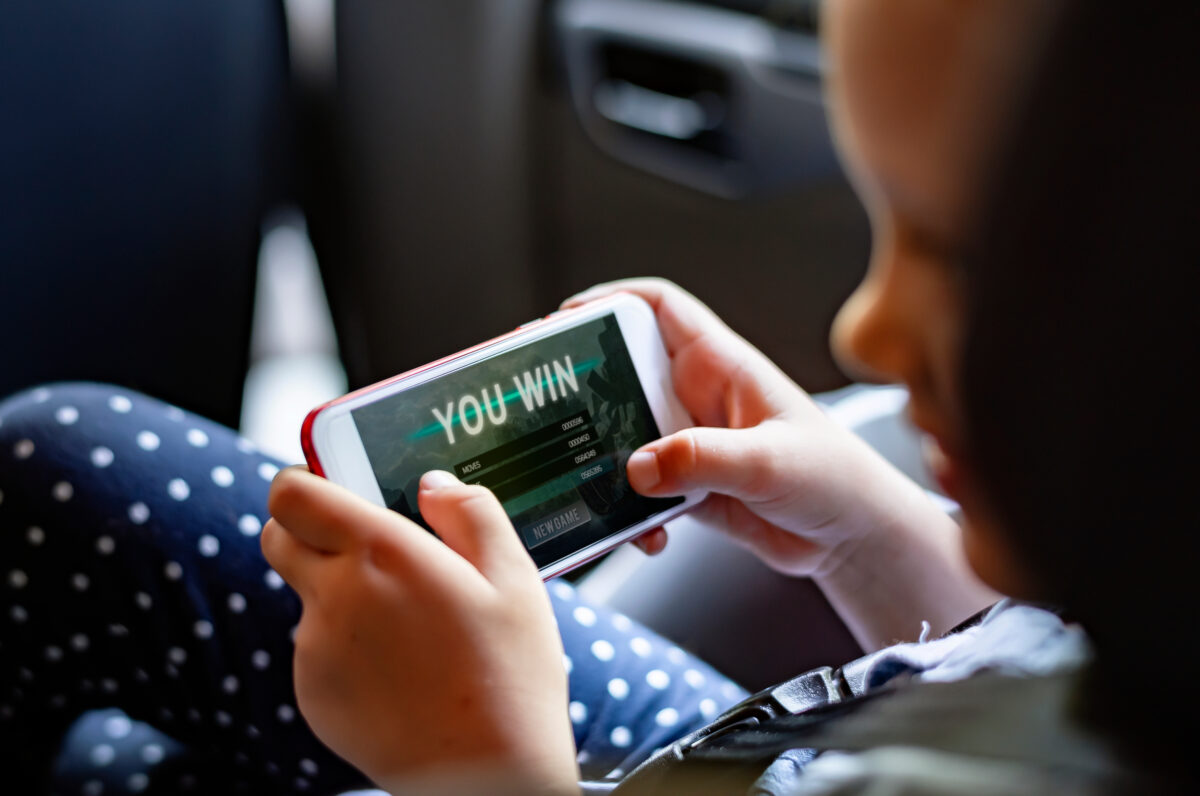 Graphic pro-Israel adverts have been shown in a number of children's video games across Europe, including the popular Angry Birds Games, here depicting a young children in a car setting playing a mobile game