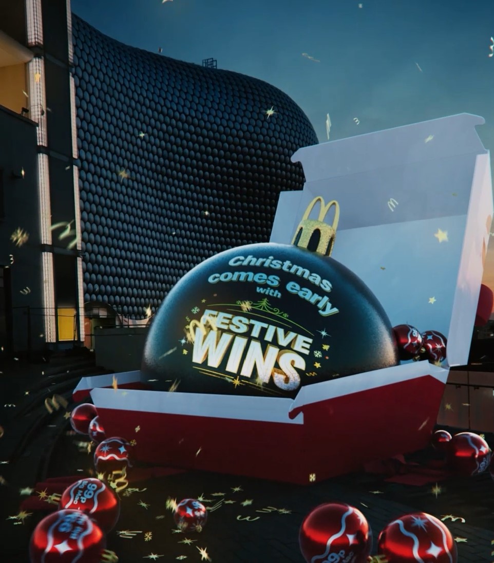 Christmas has come early with McDonald's as it becomes the latest brand to join the faux out-of-home (FOOH) trend with its new festive ad, here showing a McDonald's burger box with a big green bauble bursting out of it, surrounded by smaller red ones