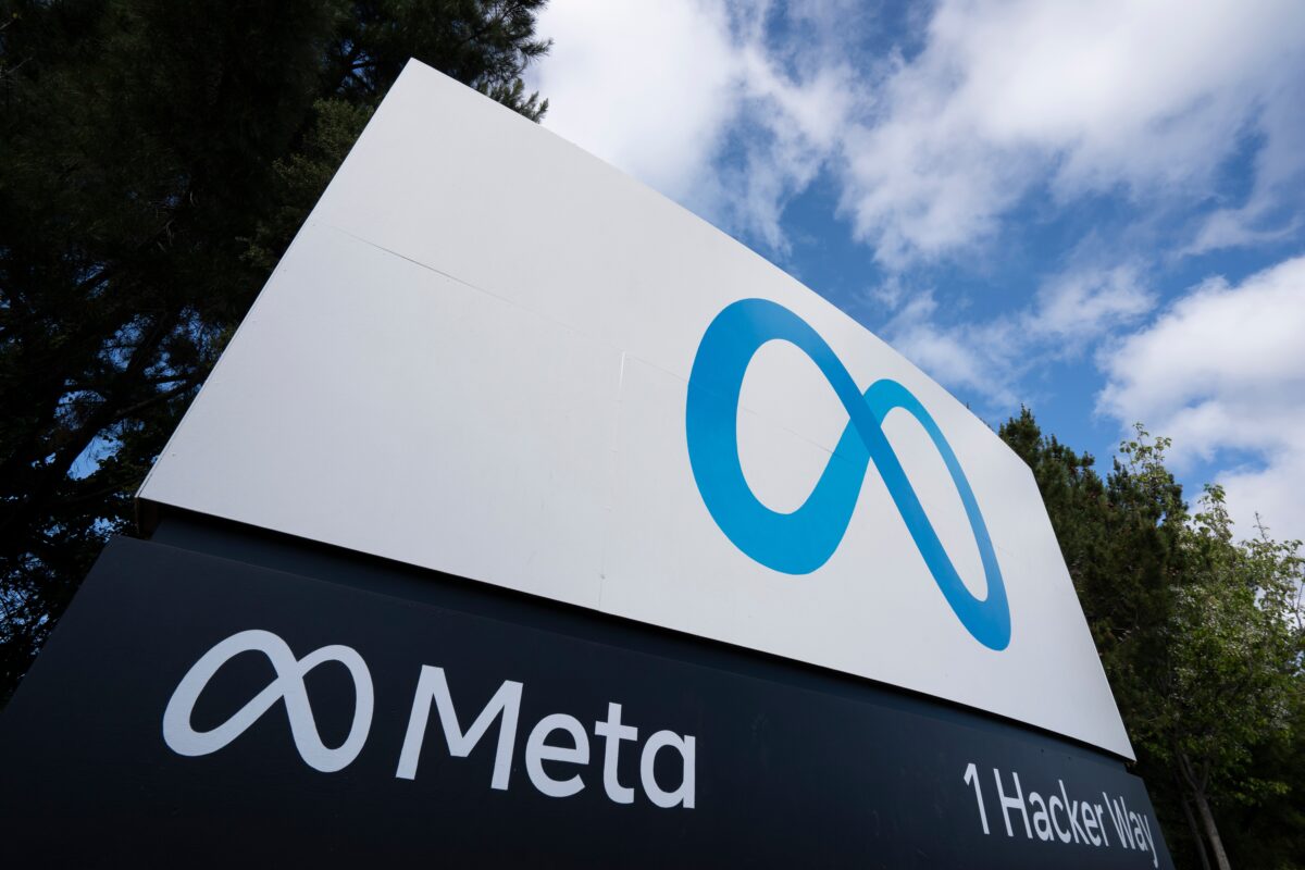 Meta has announced that its ad spend has 'softened' at the beginning of this fourth quarter, following the outbreak of the Israel-Hamas war, Meta's logo on a billboard sign depicted here