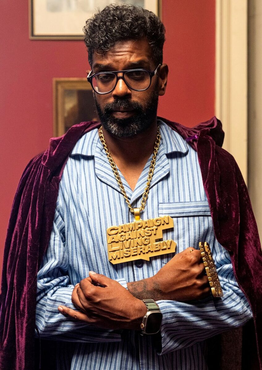 Campaign Against Living Miserably (CALM) has named comedian Romesh Ranganathan as its new Patron, alongside a pledge to raise £1 million worth of funds for its support services, depicted here