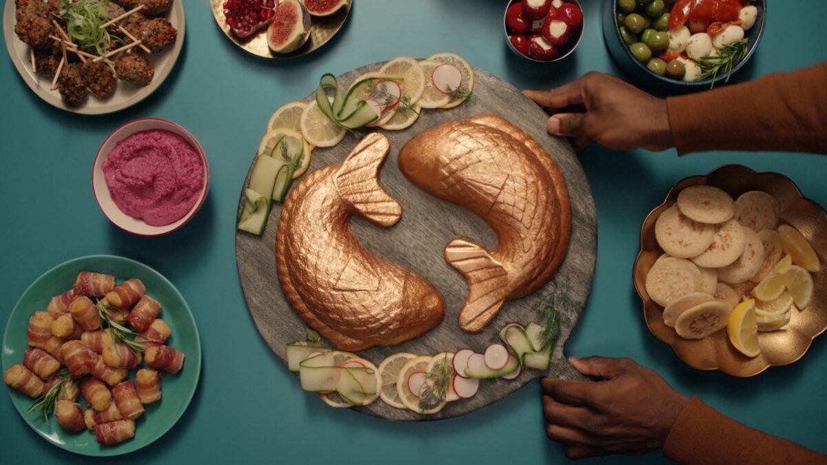 Waitrose has unveiled its festive spot, championing the 'Good Stuff' and featuring British celebrity and television host, Graham Norton, here depicting some of the food from the advert