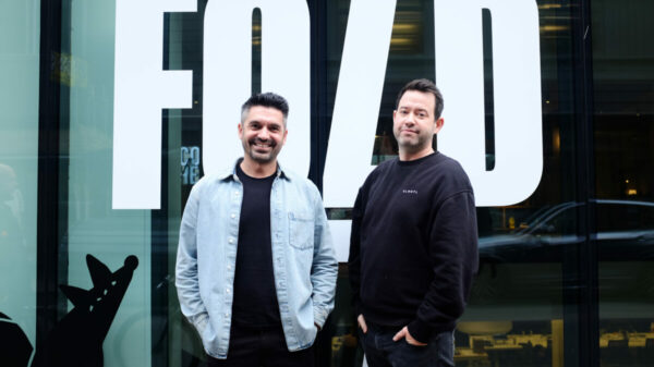Fold 7 poaches creative directors Dom Moira and Kieron Roe to bolster its award-winning team. They are pictured in casual clothes outside the agency.
