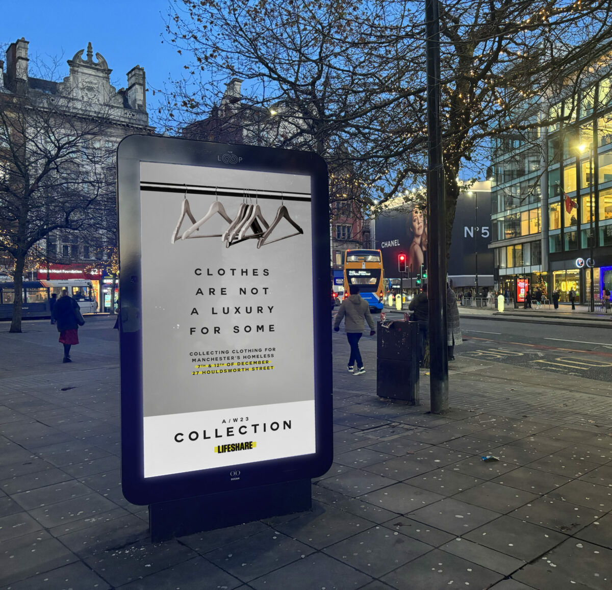 Lifeshare billboard reading "Clothes are not a luxury for some". Maxine Peake is fronting a campaign for Manchester's oldest homeless charity Lifeshare, which coincides with a Chanel's Metiers d'Art show which is currently taking place in the city.