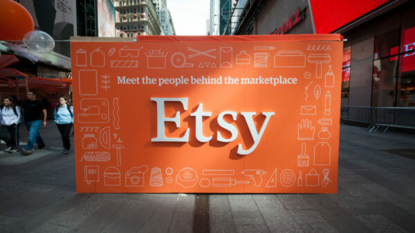 "Meet the people behind Etsy" sign. Etsy will axe its CMO role as part of major cost cuts plans which will see the business slash 11% of its workforce.