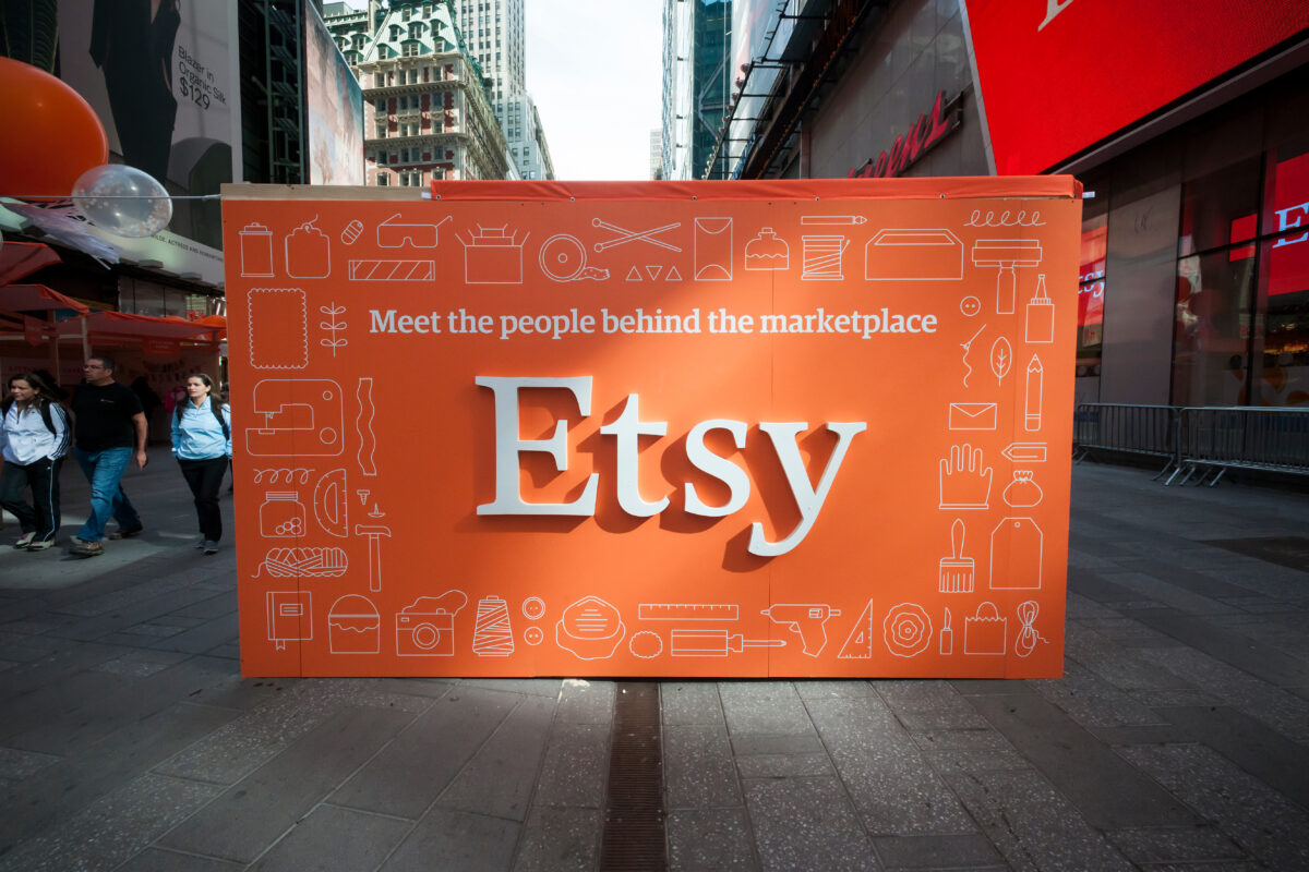 "Meet the people behind Etsy" sign. Etsy will axe its CMO role as part of major cost cuts plans which will see the business slash 11% of its workforce.