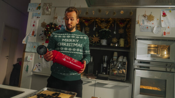 Harry Kane in a Christmas jumper attempting to get festive. Harry Kane stars in a new Prime promotion, which shows him battling the festive blues, and being cheered up by Premier League fixtures on Prime.