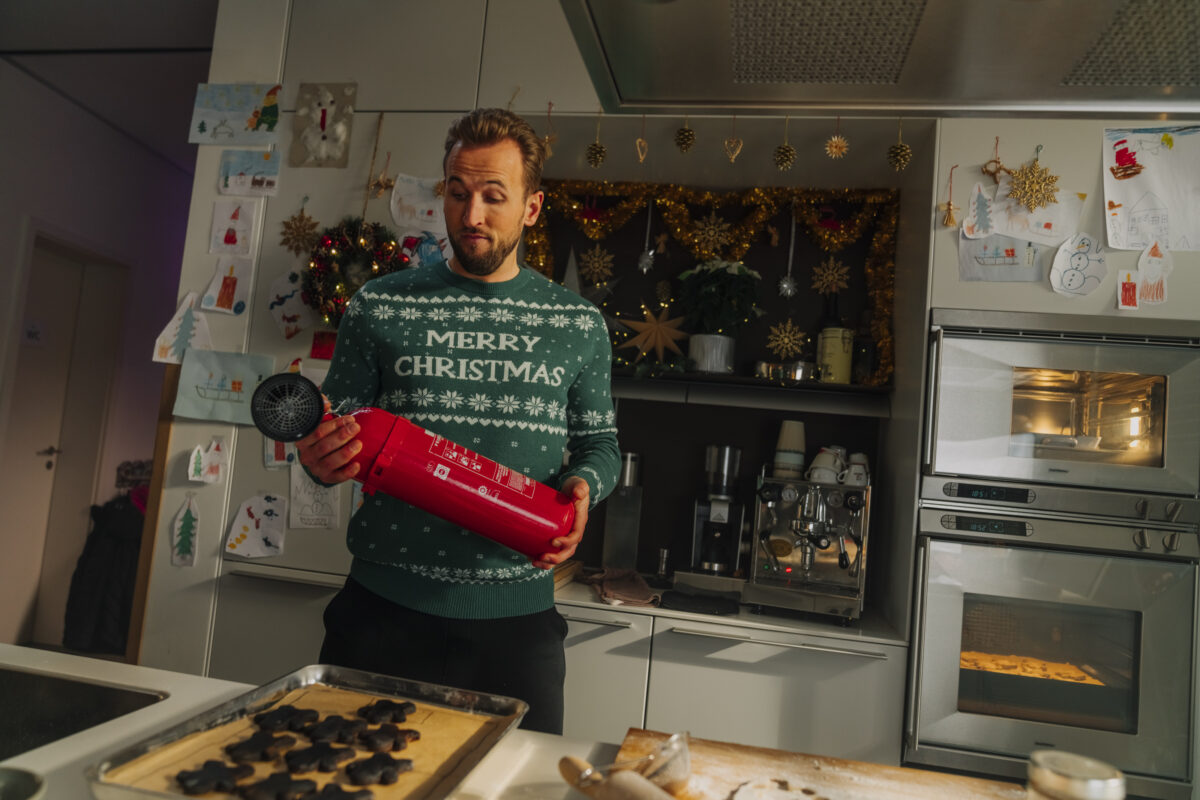 Harry Kane in a Christmas jumper attempting to get festive. Harry Kane stars in a new Prime promotion, which shows him battling the festive blues, and being cheered up by Premier League fixtures on Prime.