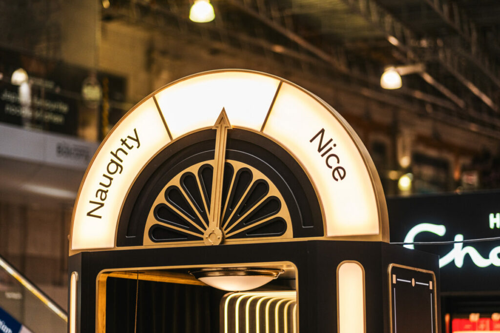 Image of Uber naughty nice booth. Uber is leaning into the festive season with a fully interactive 'Naughty or nice' booth, designed to reward customers who have top ratings on the car ride app.