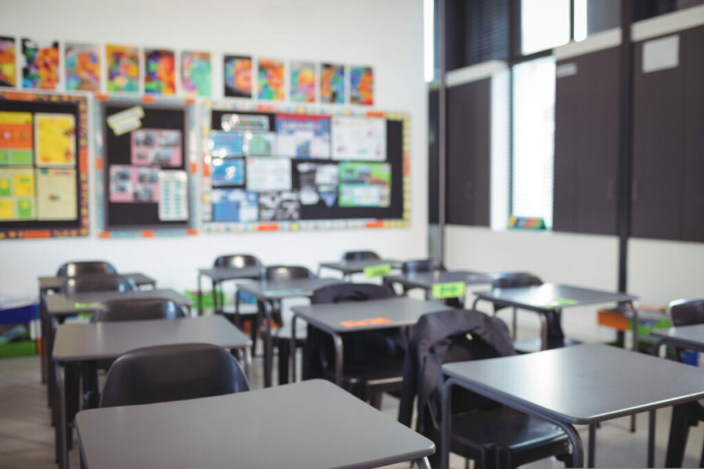 empty classroom photograph. Department for Education slammed for recent attendance campaign