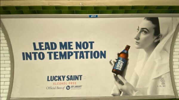 Lucky Saint dry January campaign featuring words "Divine intervention" and religiously symbolic hands with Lucky Saint Bottle. As consumers it is easy to see January as a time to start a clean slate, but how are the best marketers breaking the mould and thinking beyond?