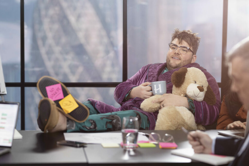 Sleepy looking worker in boardroom office drinking Horlicks. Horlicks is set to return to TV for the first time in 20 years, with a month long campaign airing from today (19 February).