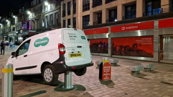 Specsavers has recreated a road accident as part of an experiential out-of-home stunt that sees a branded van stuck on a rising bollard,