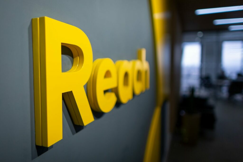 News publisher Reach has seen a drop in advertising revenue significantly impact its pre-tax profits, which have almost halved as result.