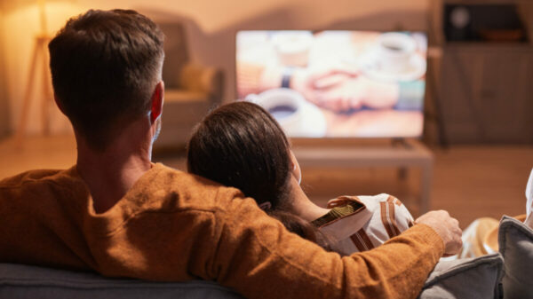 Couple on couch watching television. Living room TV screens drive the highest advertising recall, according to new findings from a study looking into the effect context has on the impact of ads.