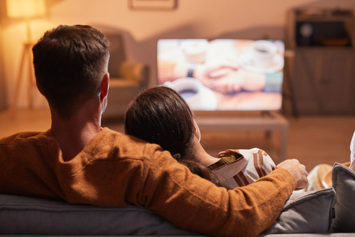 Couple on couch watching television. Living room TV screens drive the highest advertising recall, according to new findings from a study looking into the effect context has on the impact of ads.