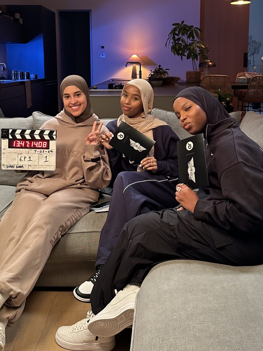 The Diary HQ trio posing on sofa. Fashion brand JD Sports and chicken shop Wingstop UK are collaborating to launch a new YouTube series featuring female YouTube trio Diary Room HQ, in an effort to meet the taste needs of the businesses' youthful audience.