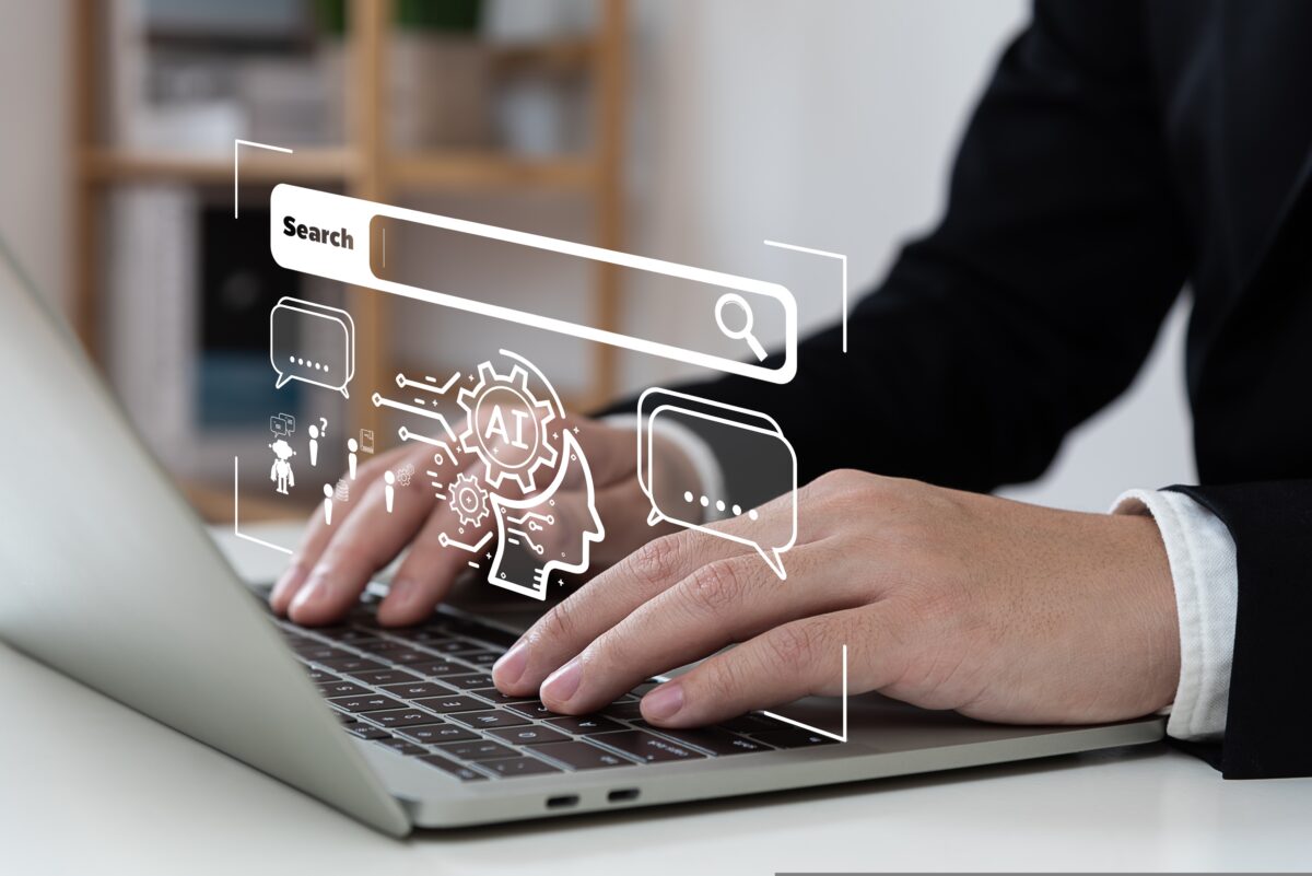 A man types on a computer, tapping into an AI search bar. Over 90% of marketers are already using or experimenting with Gen AI, a new study from IAB Europe looking into the role of the technology in digital advertising reveals.