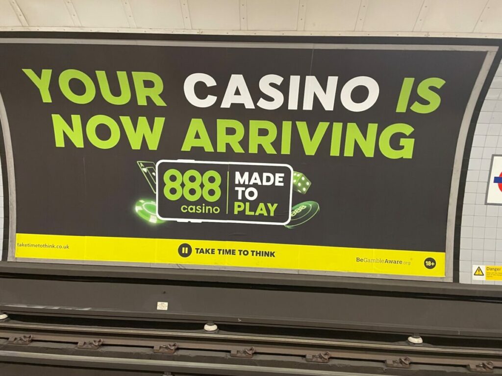 888.com is set to withdraw some of its UK ads after facing accusations that its out-of-home posters on the TfL network appear to 'trivialise' gambling.