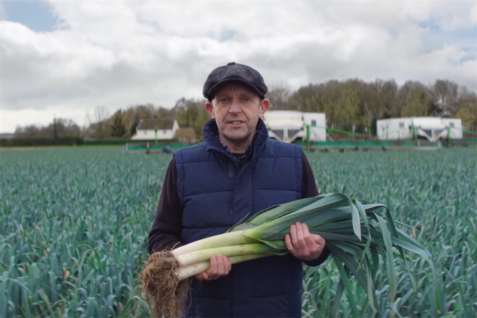 Sainsbury's farmer holding leek