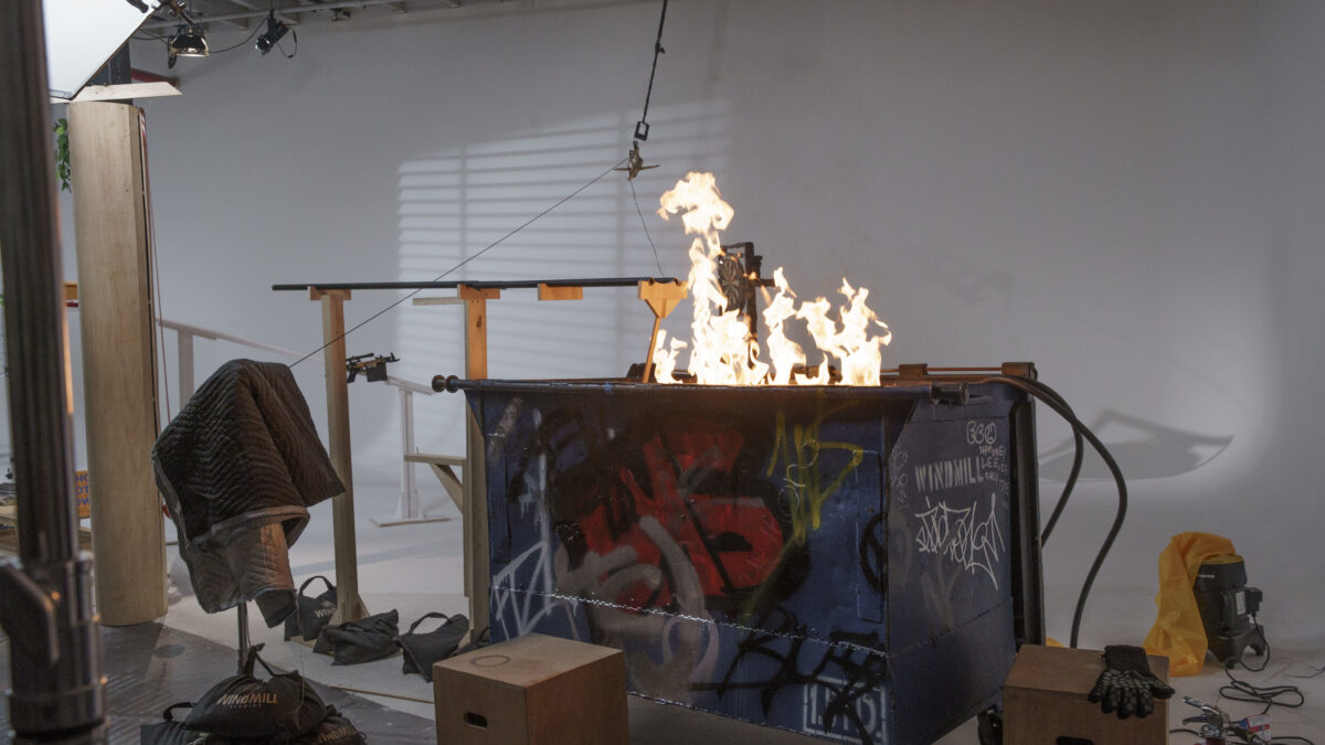 A dumpster fire representing climate change has damaged an antiquated wooden Rube Goldberg machine which was used in Honda's The Cog advert. The message makes a jibe at the ad sector's lack of forward thinking when it comes to the climate, as it continues working with the fossil fuel industry.