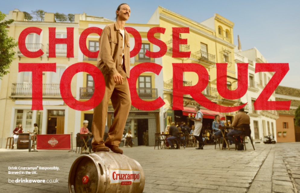 Cruz strolls nonchalantly down the sunny cobbled streets of Seville, on a beer keg. Branding reads "Choose to Cruz". Cruzcampo has shared a new ad which is set on the cobbled streets of Seville and features the Gypsy Kings iconic rendition of My Way, in order to promote its new brand platform. Cruzcampo has shared a new ad which is set on the cobbled streets of Seville and features the Gypsy Kings iconic rendition of My Way, in order to promote its new brand platform.