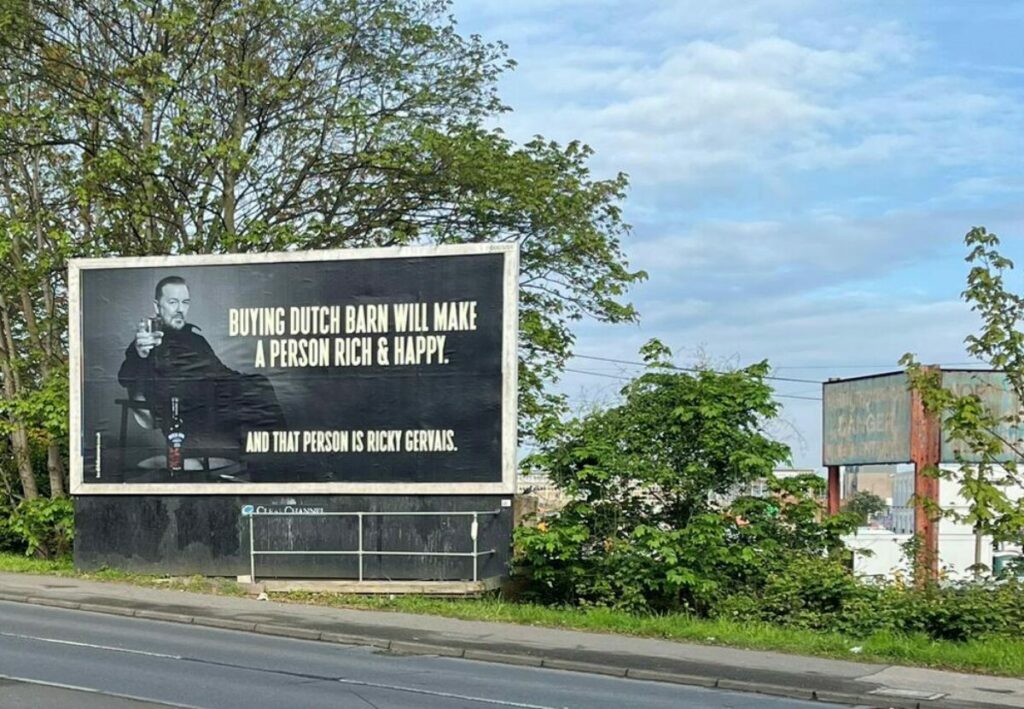 Ricky Gervais has delivered another side-splitting activation for vodka brand Dutch Barn by appearing on a giant out-of-home billboard in Slough.