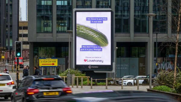 Image shows a billboard which contains a picture of a cucumber on a white background with the phrase "We have to put this in our ads. You don't have to put it in you though". Lovehoney is launching a new out-of-home campaign spotlighting the everyday household items people in the UK turn to for pleasure, in an effort to get around rules on advertising sex toys and encourage healthy conversation