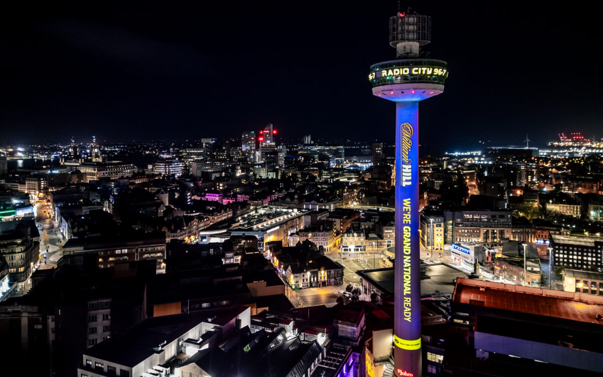 To mark the Grand National William Hill transformed Liverpool's St Johns Shopping Centre into a towering screen for the company's adverts. It is lit blue with the text "William Hill We're grand national ready"