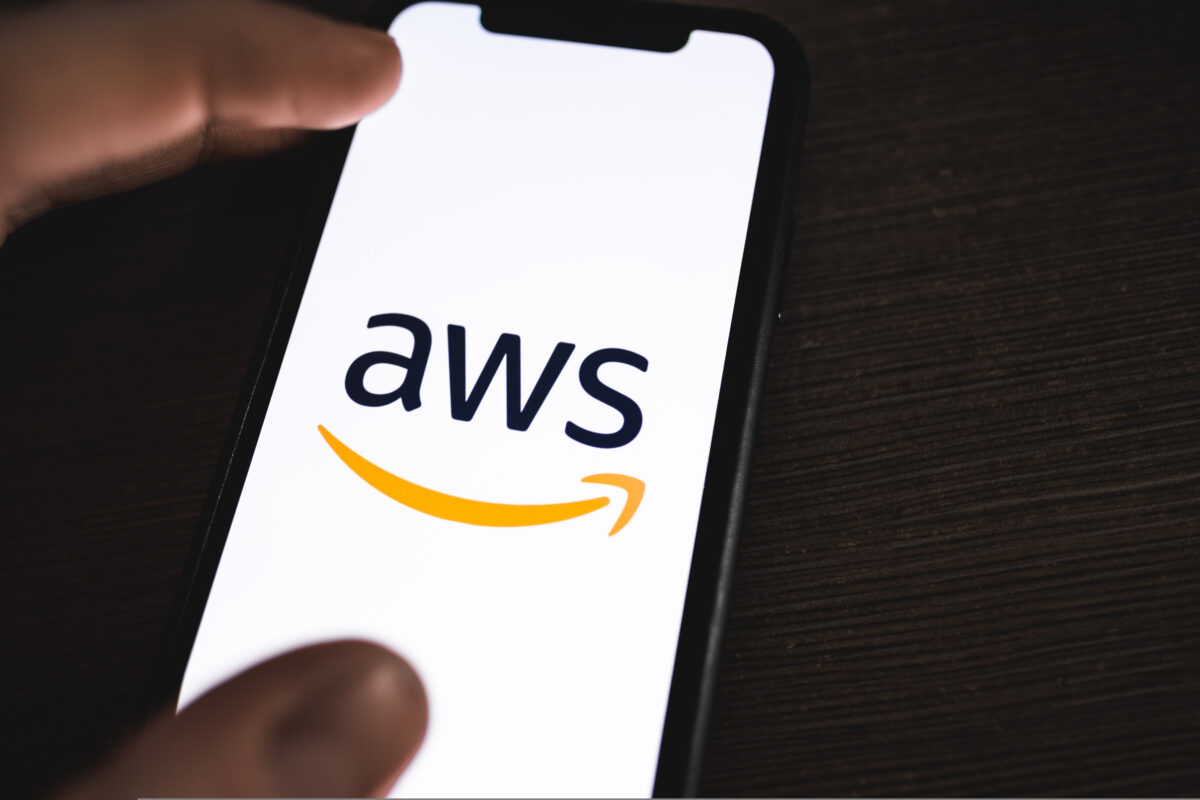 Amazon Web Service logo on a smartphone. Amazon Web Service profits triple, boosted by AI and ad sales