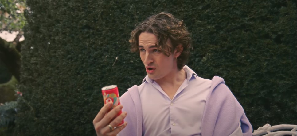 A young, floppy haired gentleman in a pink shirt stares at a J2O mocktail making a posh-looking o-shape with his mouth. J2O mockingly lashes out at the 'posh' and their occasionally extremely grating mannerisms in a rah-lly tongue-in-cheek spot aimed at showing off its summery new cocktail range.