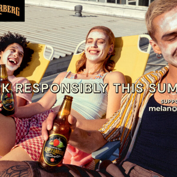 Young people slathered in suncream on sun loungers drinking in the sun. Koppaberg has partnered with charity Melanoma Fund, in order to encourage consumers to drink responsibly in the sun this summer.