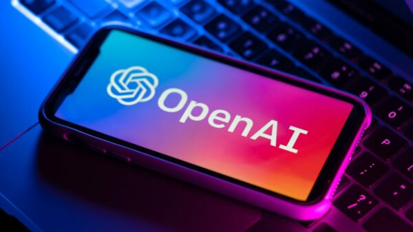 Open AI branding on phone and laptop. Open AI has announced a new deal with News Corp under which it will be able to display news content from the mastheads.