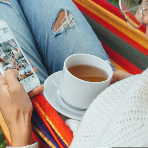 A woman in a colourful hammock aimlessly scrolls through Instagram - cup of tea in hand. Instagram is testing adverts that users are unable to skip past, in a controversial new move which will see a timer count down to zero before they can scroll again.