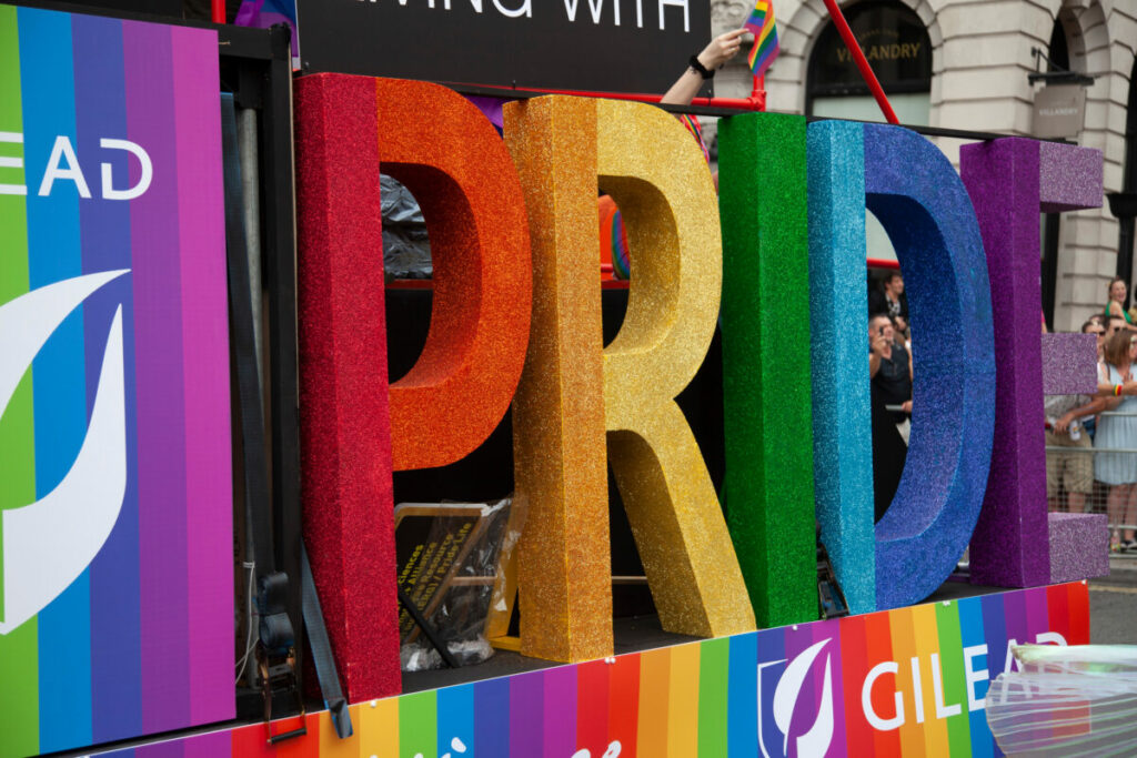 A float reads Pride in the pride rainbow colours.