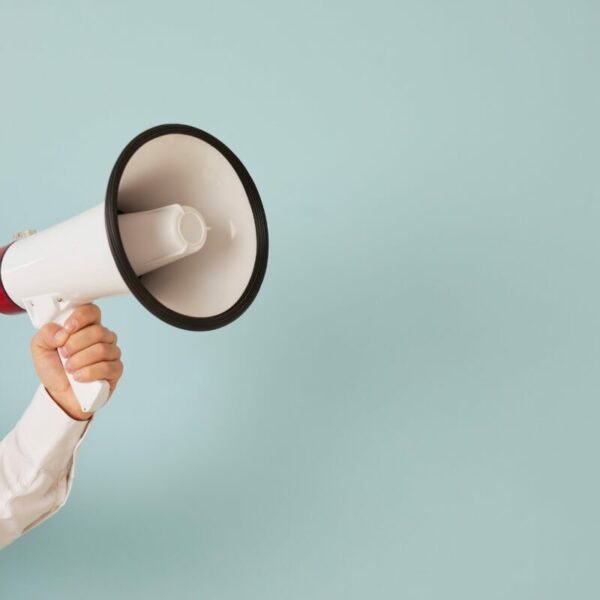 Businessman holds megaphone. Optimal attention level for engagement and conversion differs for each brand, according to new measurement data from Playground xyz.