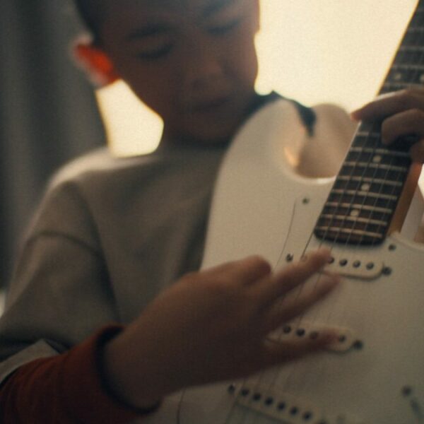 Nine-year-old guitar prodigy jams in his bedoommm focusing intently on his white electric guitar. EDF has joined forces with Lucky Generals to launch a new brand platform, backed by a multi-million pound media plan from Havas Media UK.