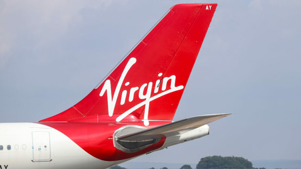 Virgin Atlantic plane against a grey sky. The logo takes centre stage.