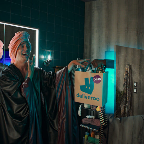 Villainous character laughs as hey hold up a deliveroo bag while getting ready for the evening ahead dressed in a long black cloak and a pink head towel. Food delivery company Deliveroo has partnered with its agency of record Pablo to create a new brand platform to highlight its new loyalty offering.