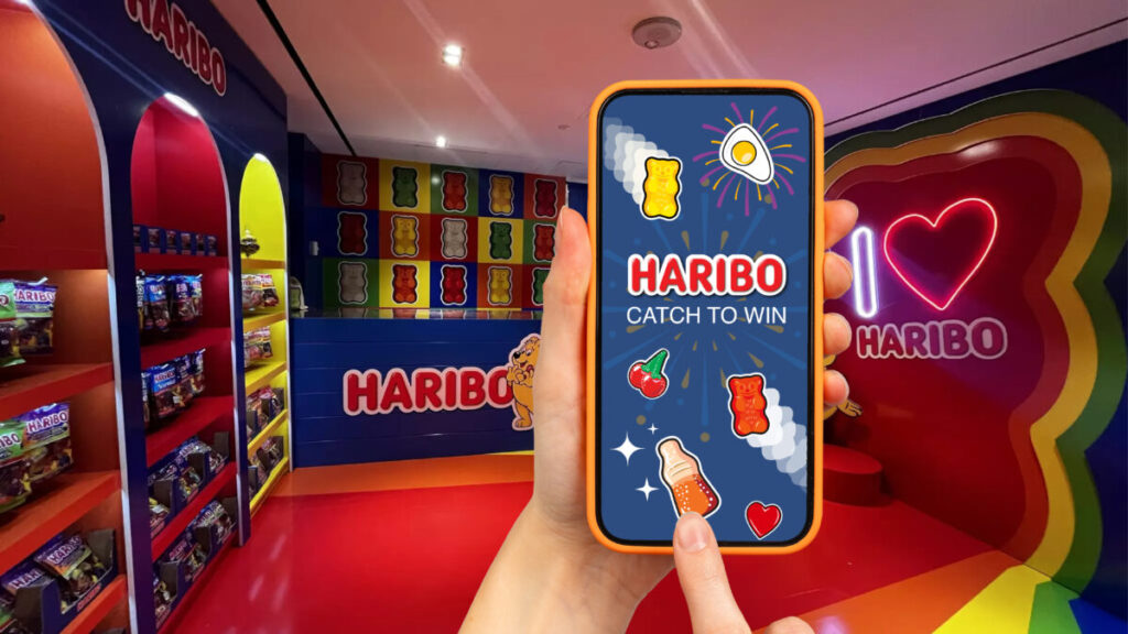 Colourful in-airport activation with a heart sign reading I love Haribo. Haribo has unveiled a new airport-wide activation around a 'Giant Wheel' game.
